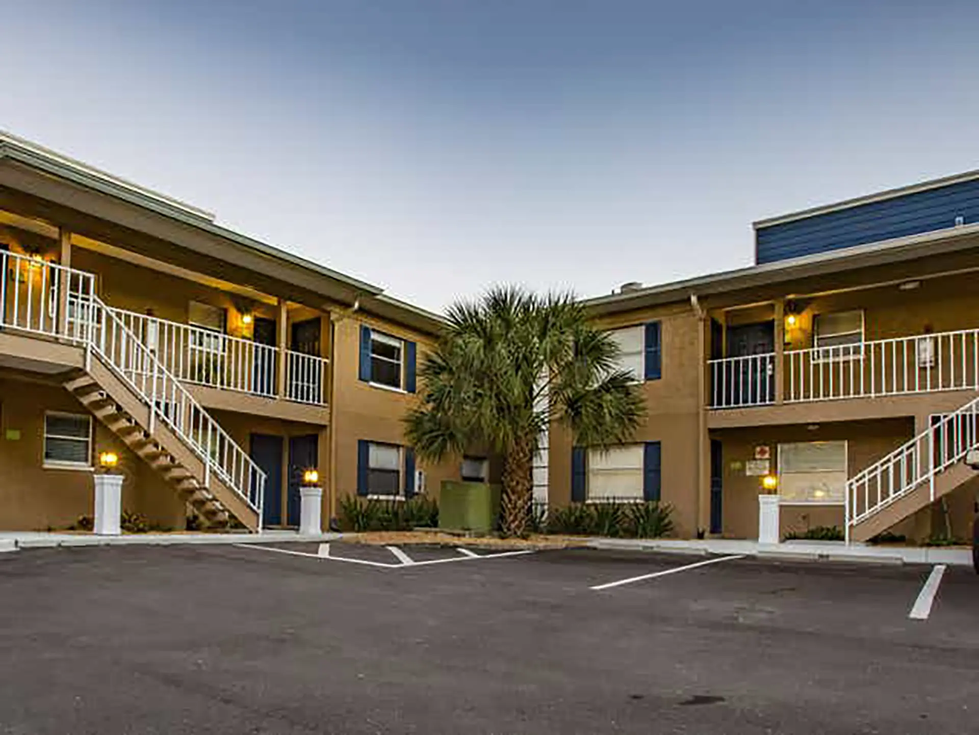 artiisan cove exterior with parking lot and two-story building